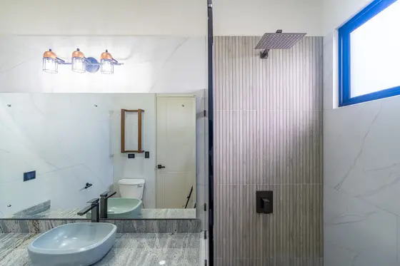 Reference image of the previous home, not the updated design · Riverbend Design 1 — bathroom