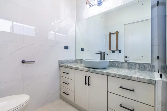Reference image of the previous home, not the updated design · Riverbend Design 1 — bathroom