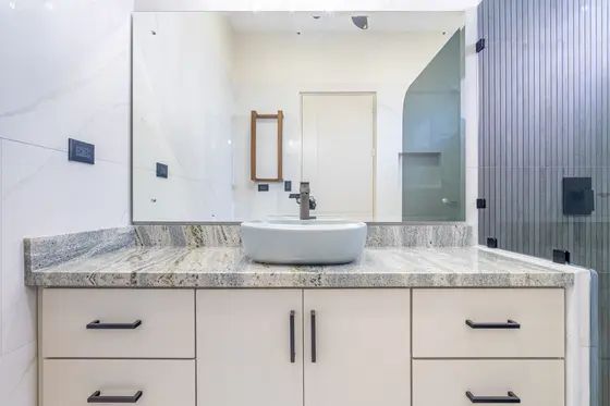 Reference image of the previous home, not the updated design · Riverbend Design 1 — bathroom